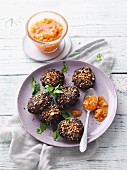 Black lentil and chia fritters with spicy apricot salsa