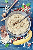 Healthy breakfast: Home made oatmeal porridge, goji berries, banana, pumpkin and chia seeds