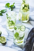 Green sangria with melon, cucumber, basil, mint, grapes and lime drink