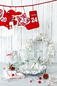 Christmas decorations and preserving jars on white table