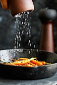 Honey Glazed Carrots on a cast iron pan