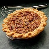 Sall pecan pie with whisk