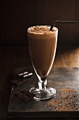 Milkshake with dark chocolate in a dessert glass