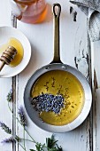 Honey and lavender buds in a pan