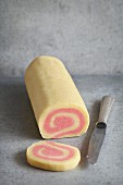 Pink pinwheel cookies roll dough before baking with strawberry and vanilla