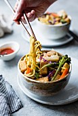 Curried noodles with crispy tofu and winter vegetables, gluten-free and vegan