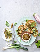 Sandwiches with spicy eggplant and chermoula paste, tofu and fried leeks