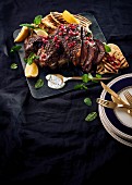 Spiced lamb with peppermint, pomegranate seeds, lemon and grilled bread