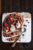Sweet nutella pizza with baklava ice cream and berries