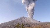 Volcano erupting with ash in sky, Sakurajima