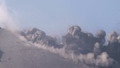 Volcanic ash rising up from hillside, Sakurajima