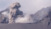 Volcano crater with ash billowing into sky, Sakurajima