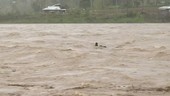 Flooded river following hurricane, Philippines