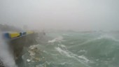 Storm waves hitting sea wall, Japan