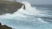 Typhoon waves hitting cliffs