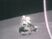 Apollo 17 astronaut handling objects on the Moon