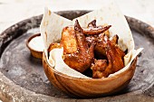 Fried Chicken Wings in wooden bowl