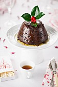 Christmas Pudding with brandy on a cake stand