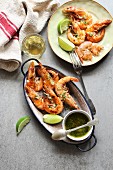 Grilled prawn with garlic salsa sauce on an enamel plate