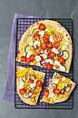 Vegetarian focaccia with pepper, courgette, onion, cherry tomatoes and feta