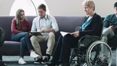 Doctor consulting patient in hospital waiting room