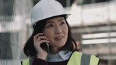 Architect speaking on phone on construction site