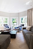 Window bay flooded with light in elegant living room