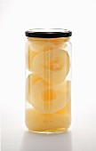 Preserved pear halves in a jar