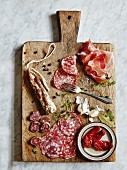 Fine meats and delicatessen. Served on a vintage cutting board