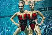 Two synchronised swimmers underwater