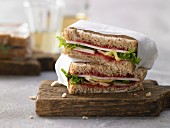 A goat's cheese sandwich with lettuce and cranberry sauce