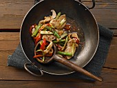 Chicken and vegetable stir fry with asparagus, peppers and cashew nuts