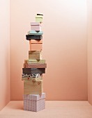 Various storage boxes against pink wall