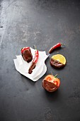 Fruits, chillli and tomatoes with a chocolate glaze
