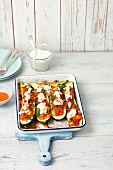 Courgette stuffed with beef and tomatoes with yogurt