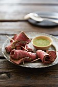 Beef fillet skewers with a herb sauce