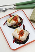 Hake on grilled aubergines with peppers
