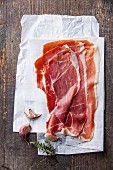 Ham slices on wooden background