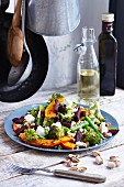 Grilled pumpkin salad with chickpeas, beans, beetroot and pistachios