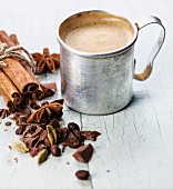 Coffee in aluminum mug with spices
