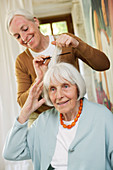 Woman helping elderly woman