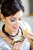 Woman eating oyster