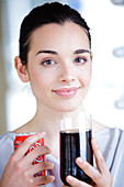 Woman drinking a soda