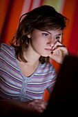 Teenage girl using a laptop
