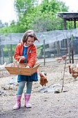 Girl in a hen house