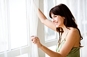 Woman looking out window