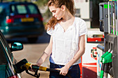 Woman at petrol station