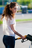 Woman at petrol station