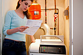 Woman checking her boiler