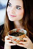 Woman drinking hot beverage